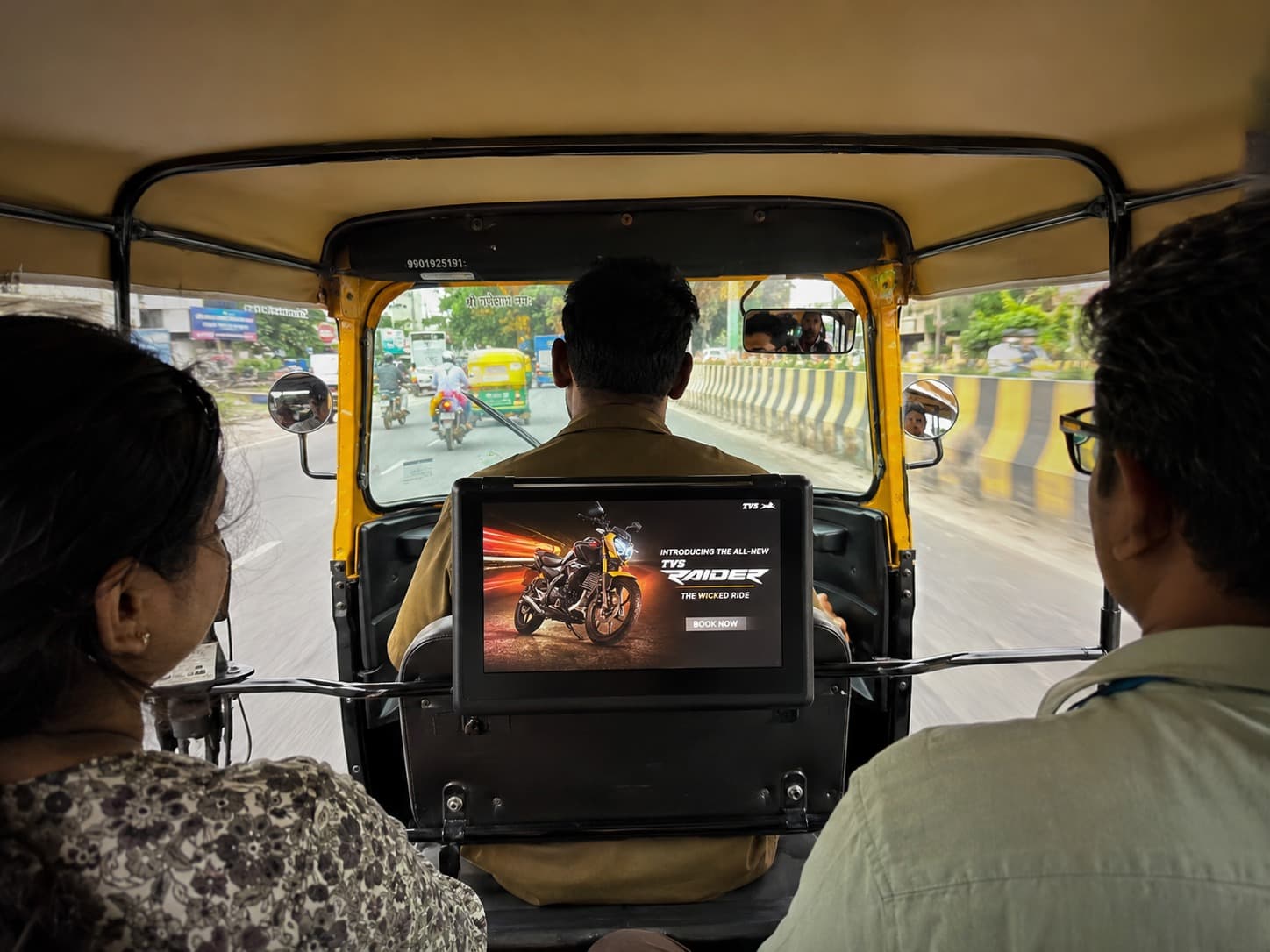 HappyFrU display running an ad inside an auto-rickshaw